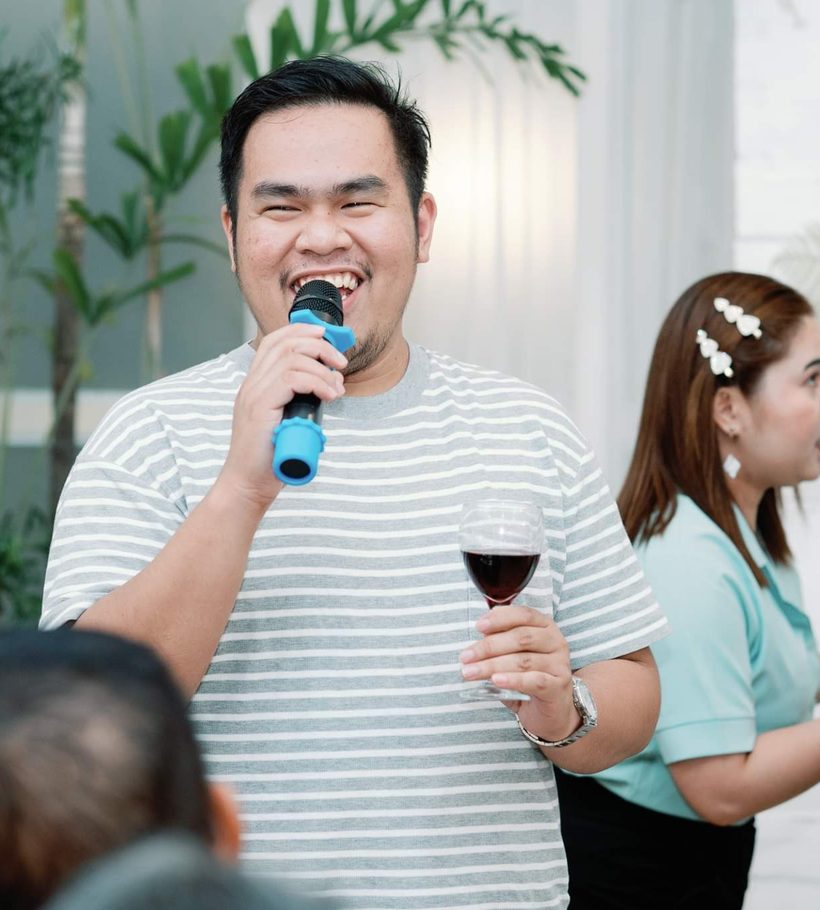 Alvin Solteo smiling while speaking into a microphone